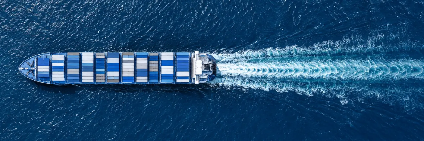 Illustrative generated aerial image of a container ship under way.